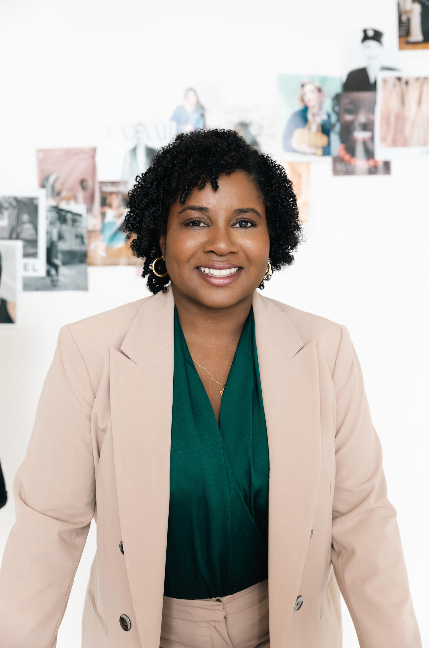 bria-johnson-personal-stylist-bio-portrait.jpg Bria Johnson, Chief Style Strategist and Founder of I.C.O.N.I.C With Style, smiling in a tan suit during her brand portrait session, with a mood board in the background