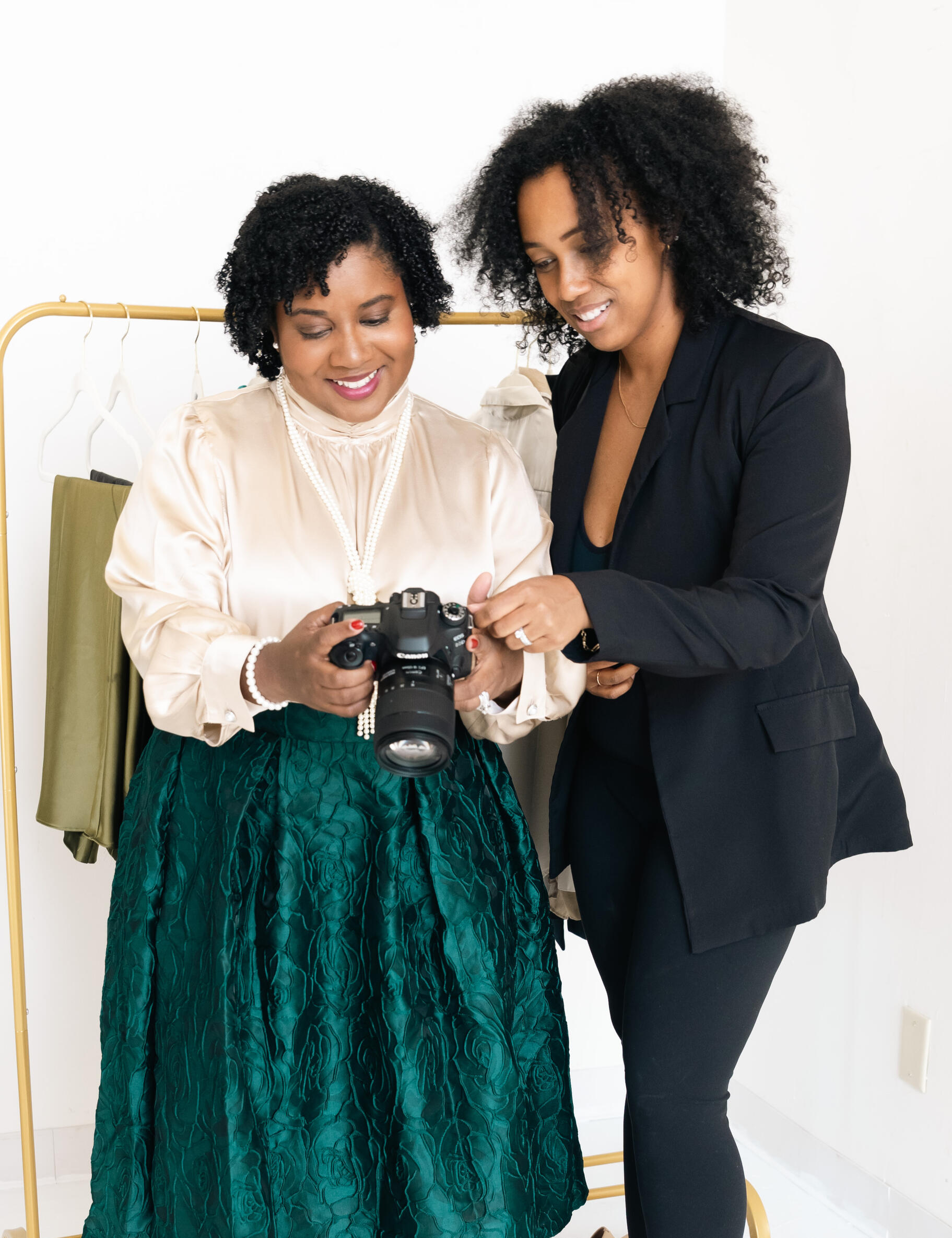 Bria Johnson reviewing images on a camera with a client during an image diagnostic session.